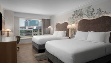 Premium bedding, pillow-top beds, desk, laptop workspace