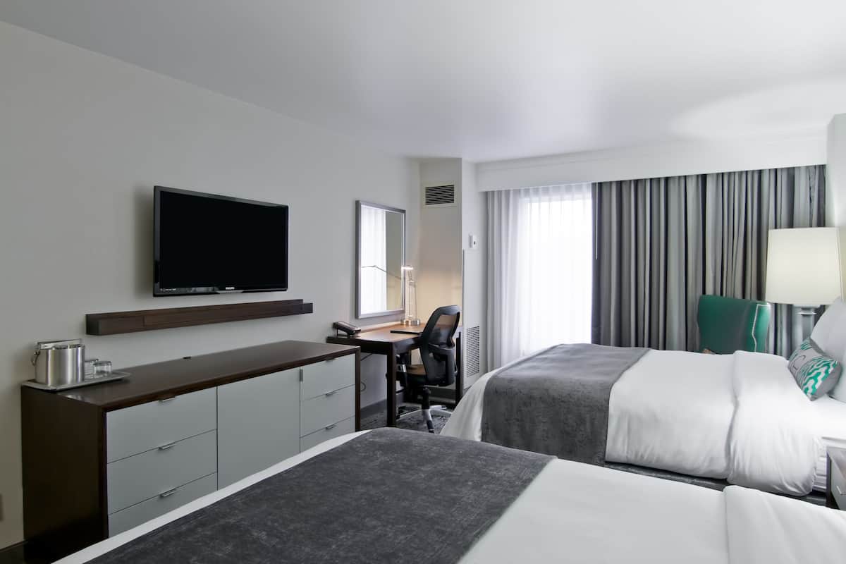 Premium bedding, pillow-top beds, desk, laptop workspace