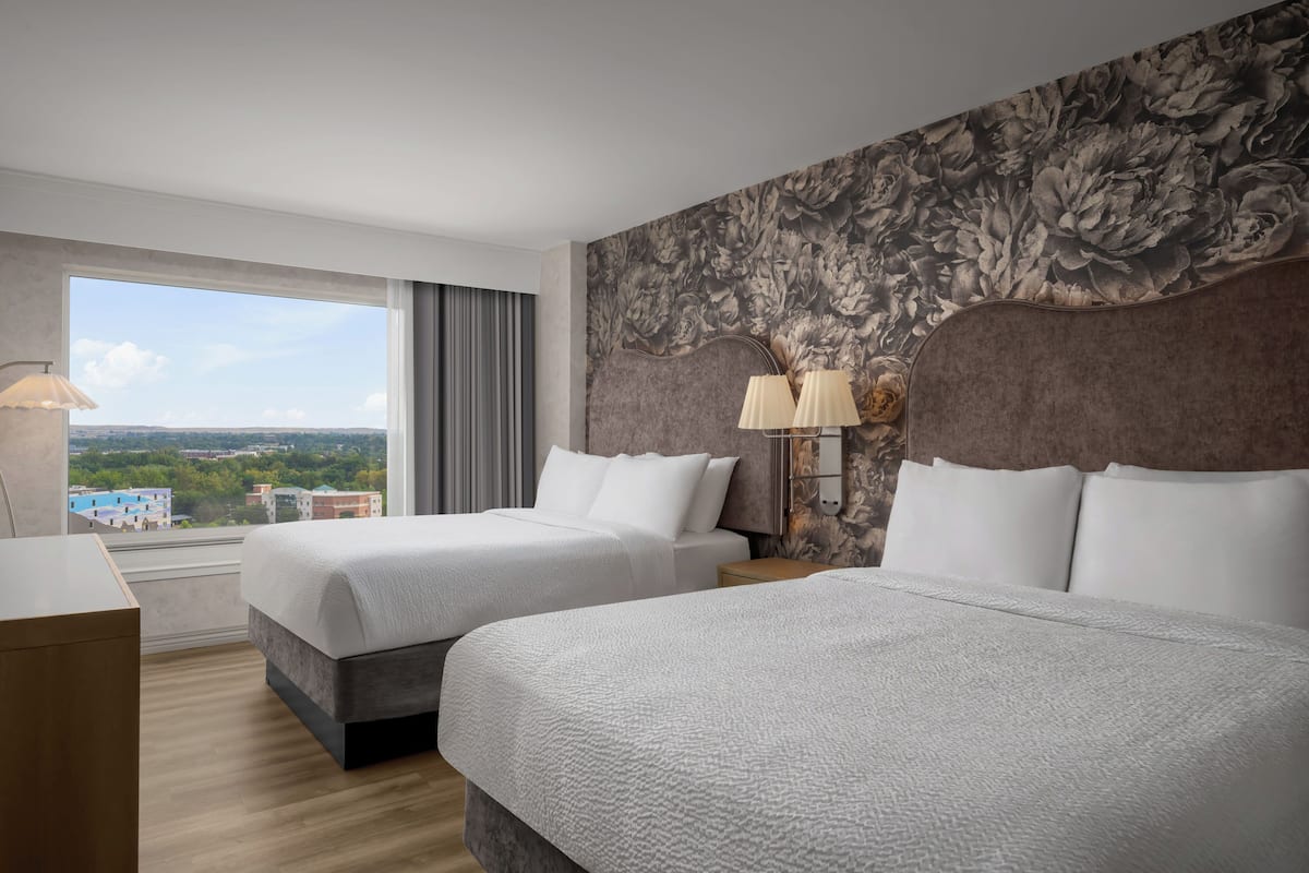 Premium bedding, pillow-top beds, desk, laptop workspace
