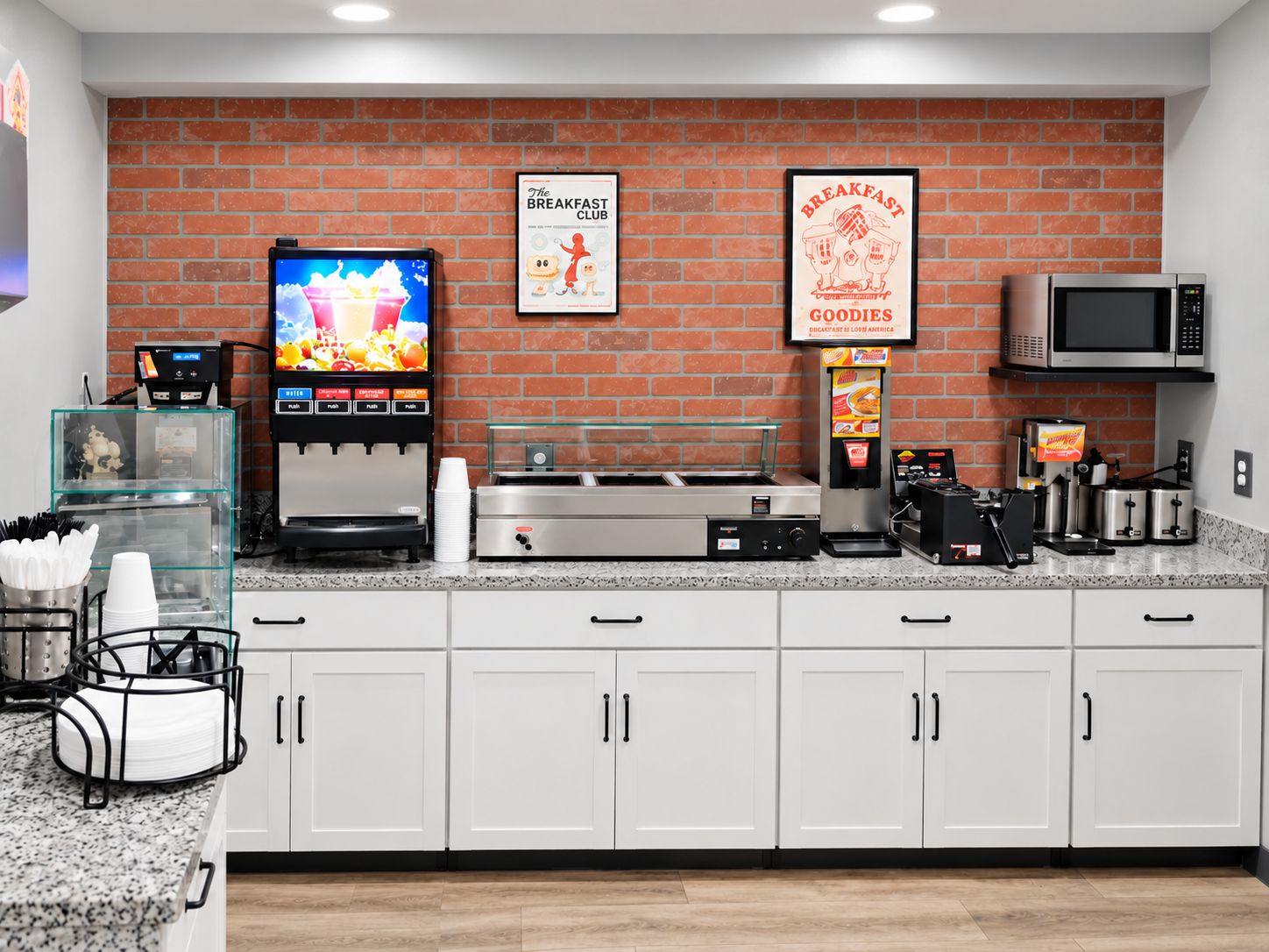 A breakfast counter with a coffee machine, a TV displaying a breakfast scene, and a sign for 'The Breakfast Club'.