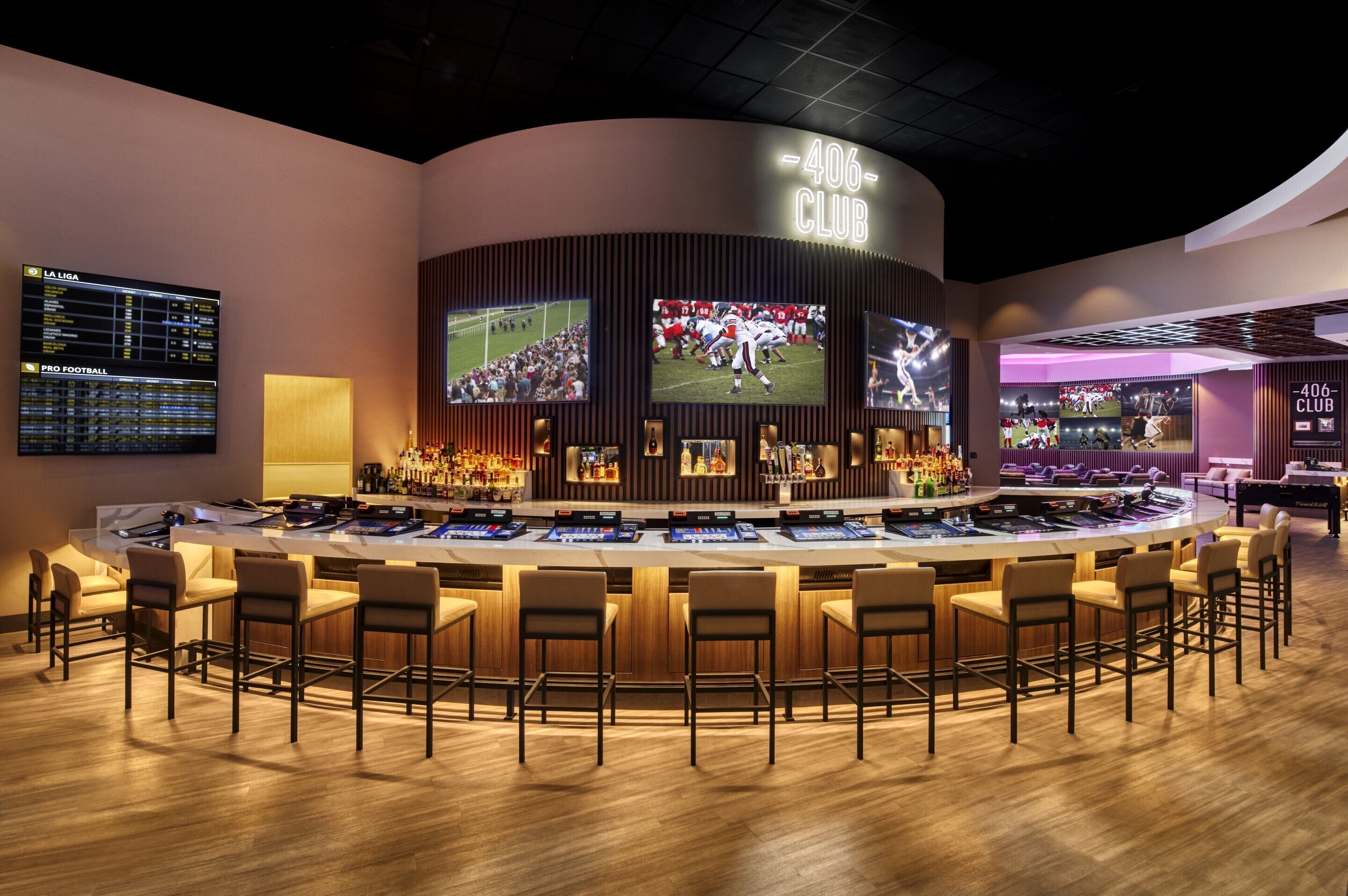 A bar area with multiple screens displaying sports events, a bar counter with stools, and a sign reading "406 CLUB".