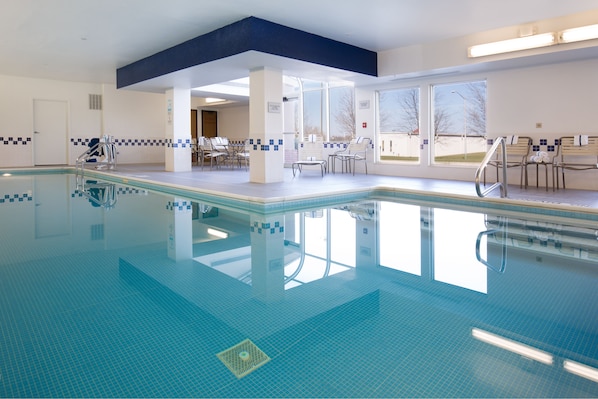 Indoor pool, open 7:00 AM to midnight, pool loungers