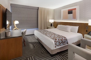 Premium bedding, in-room safe, desk, laptop workspace at Fremont Hotel & Casino