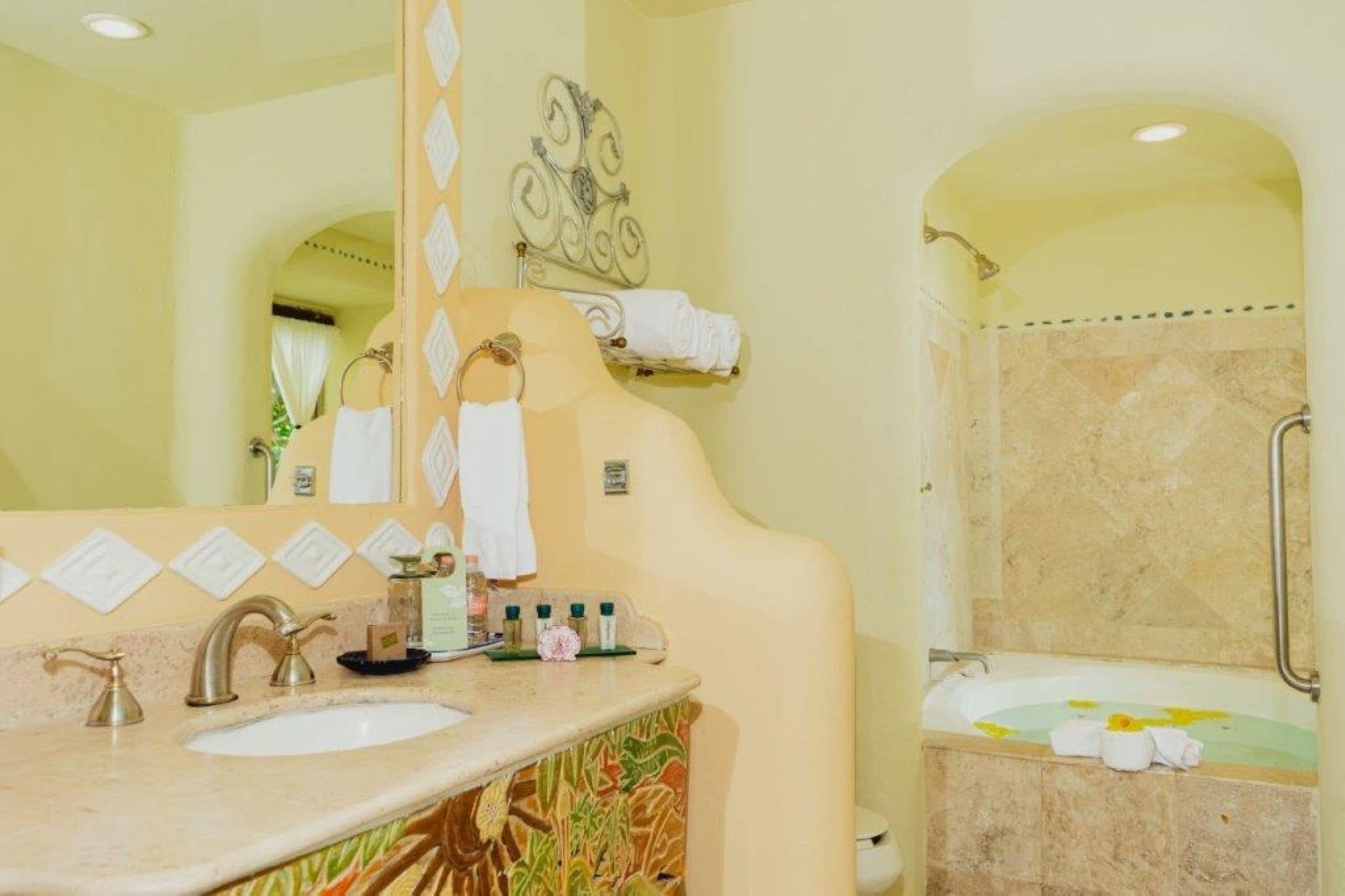 designer toiletries, hair dryer, bathrobes, slippers