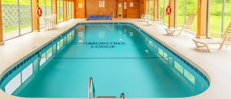 A swimming pool at Smoketree Lodge with a 3 ft depth marker, wooden interior, and outdoor views.