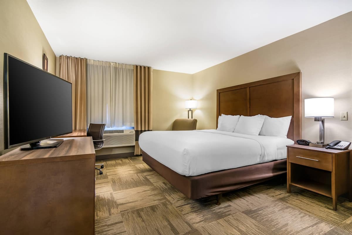 Premium bedding, blackout curtains, iron/ironing board