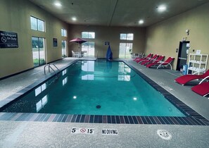 Indoor pool, open 10:00 AM to 10:00 PM, pool loungers