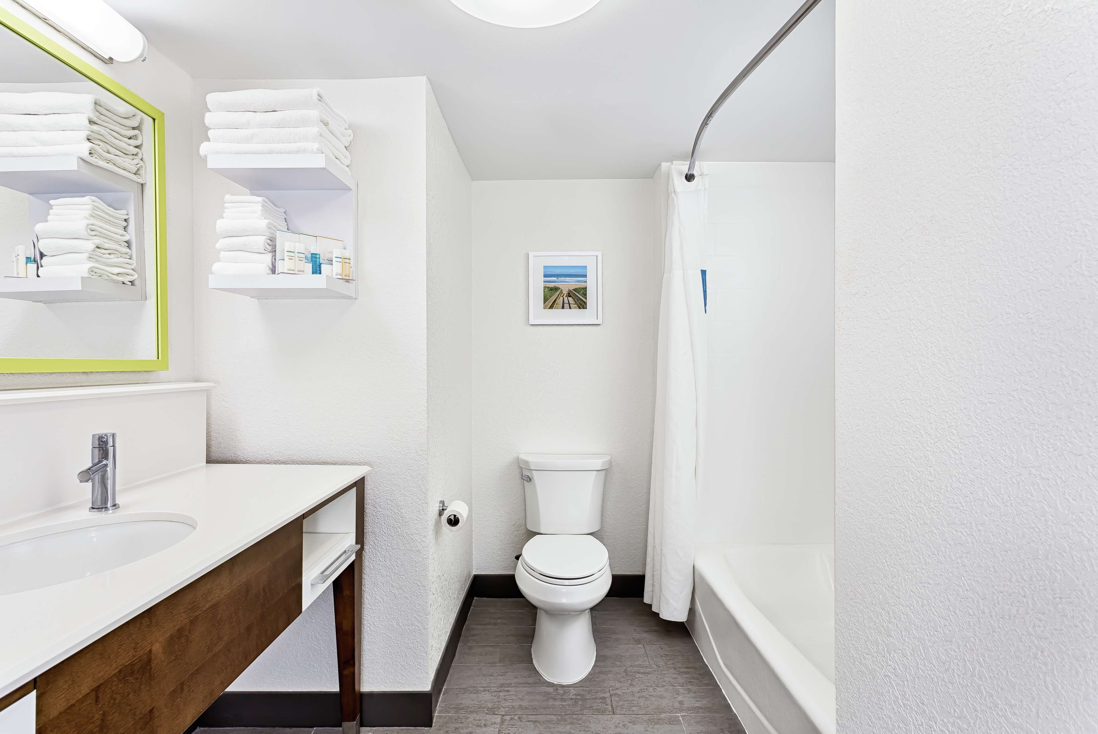 eco-friendly toiletries, hair dryer, towels