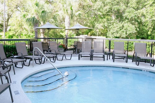 Outdoor pool, open 7:00 AM to midnight, pool umbrellas, sun loungers