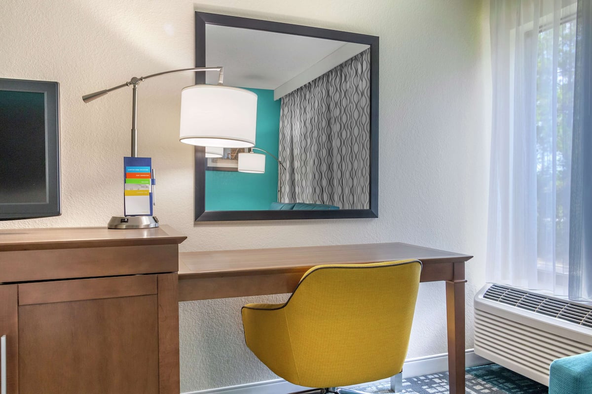 Desk, laptop workspace, blackout curtains, iron/ironing board