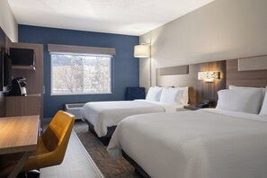 A hotel room with two beds, a desk, a chair, a microwave, and a window with a view of trees. - Holiday Inn Express & Suites American Fork - North Provo by IHG (American Fork)