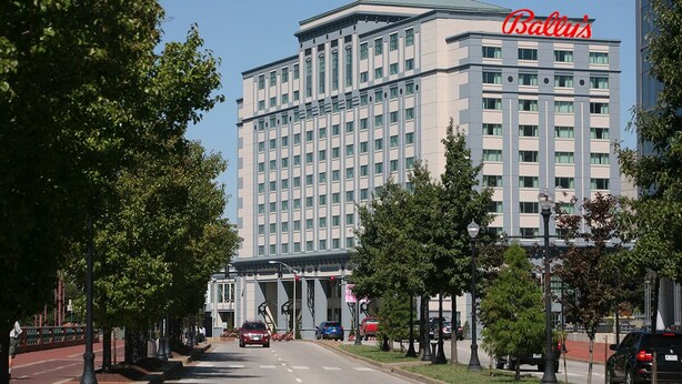 A large hotel building with a prominent sign reading "Ballus".
