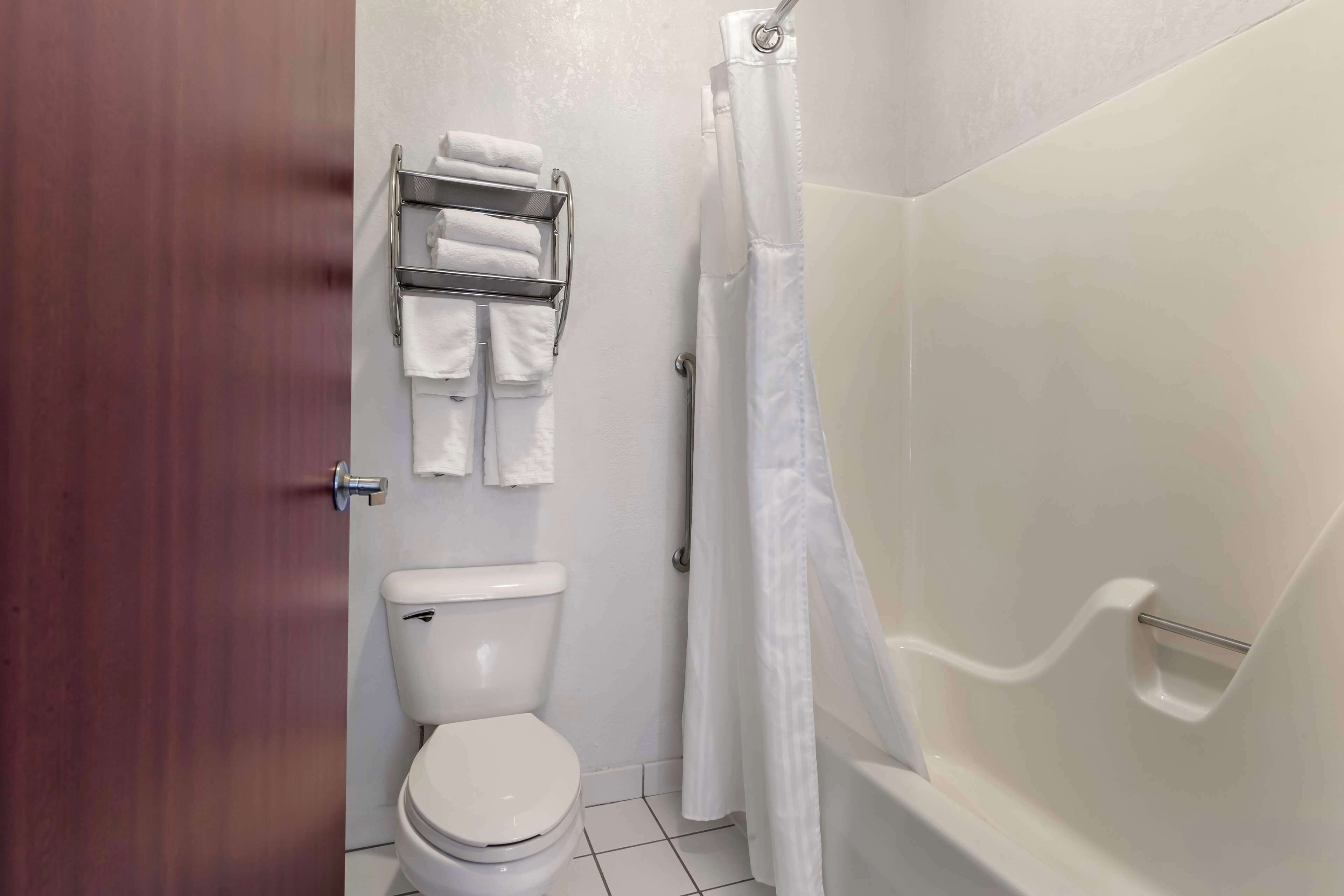 standard room, 2 queen beds, non smoking, refrigerator & microwave | bathroom | combined shower/bathtub, hair dryer, towels