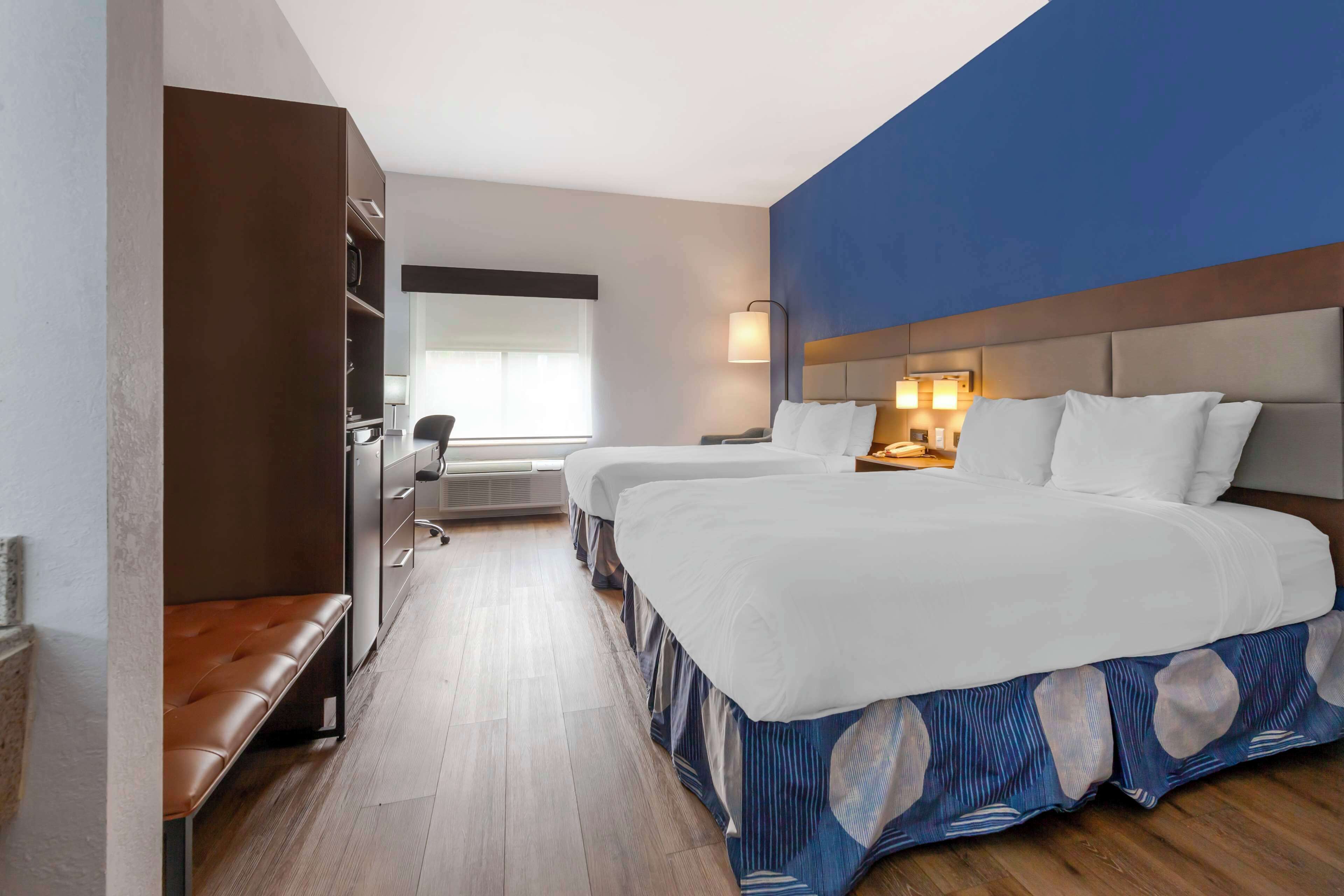 standard room, 2 queen beds, non smoking, refrigerator & microwave | 1 bedroom, desk, free cots/infant beds, rollaway beds