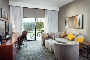 Suite, 1 King Bed with Sofa bed | Living area | TV