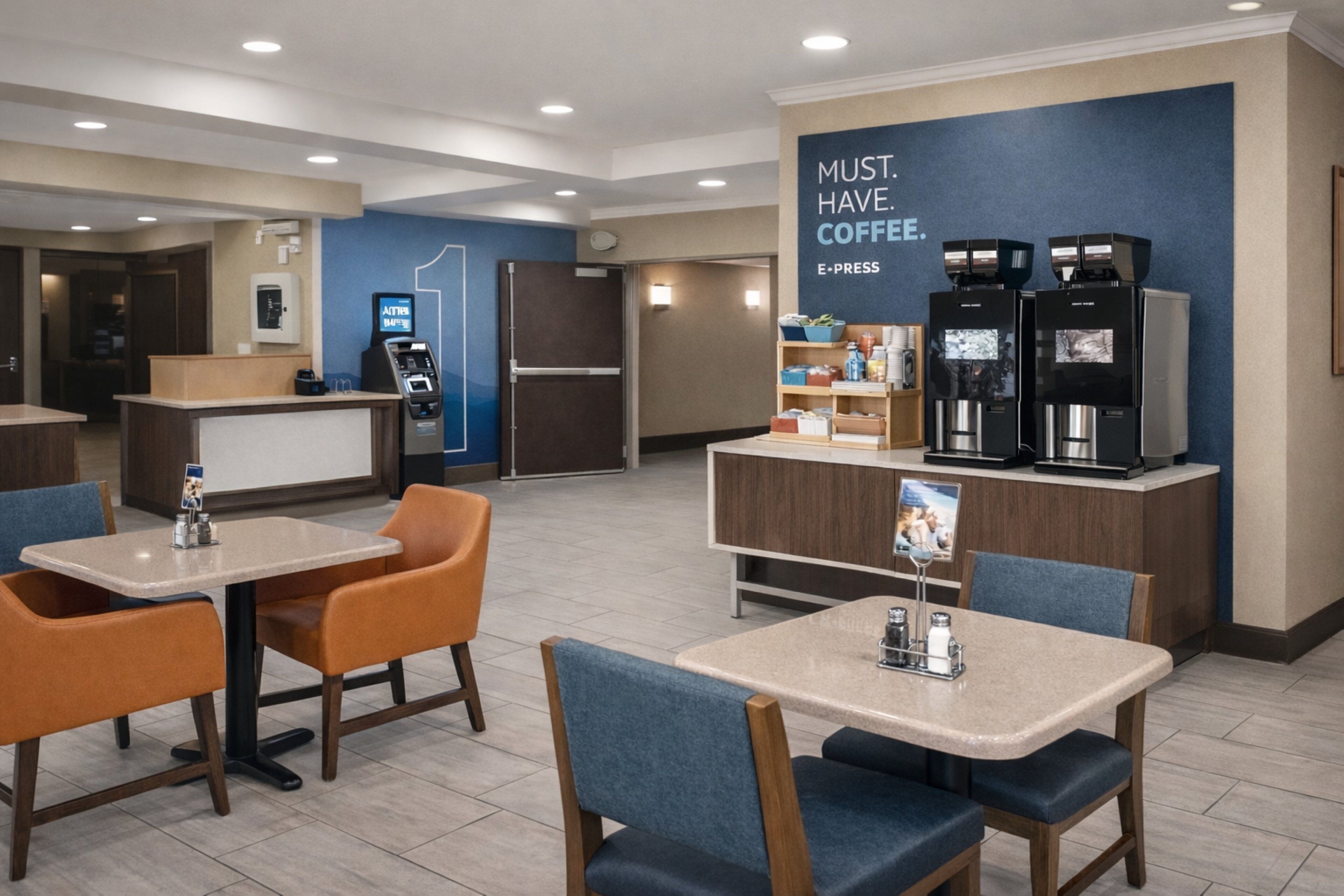A modern coffee shop with tables and chairs, a refrigerator, and a coffee machine.