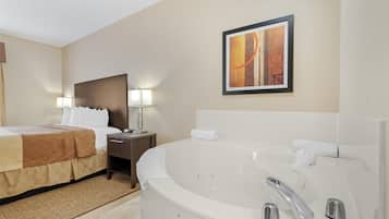 Suite, 1 King Bed, Non Smoking, Jetted Tub | Desk, laptop workspace, blackout curtains, iron/ironing board