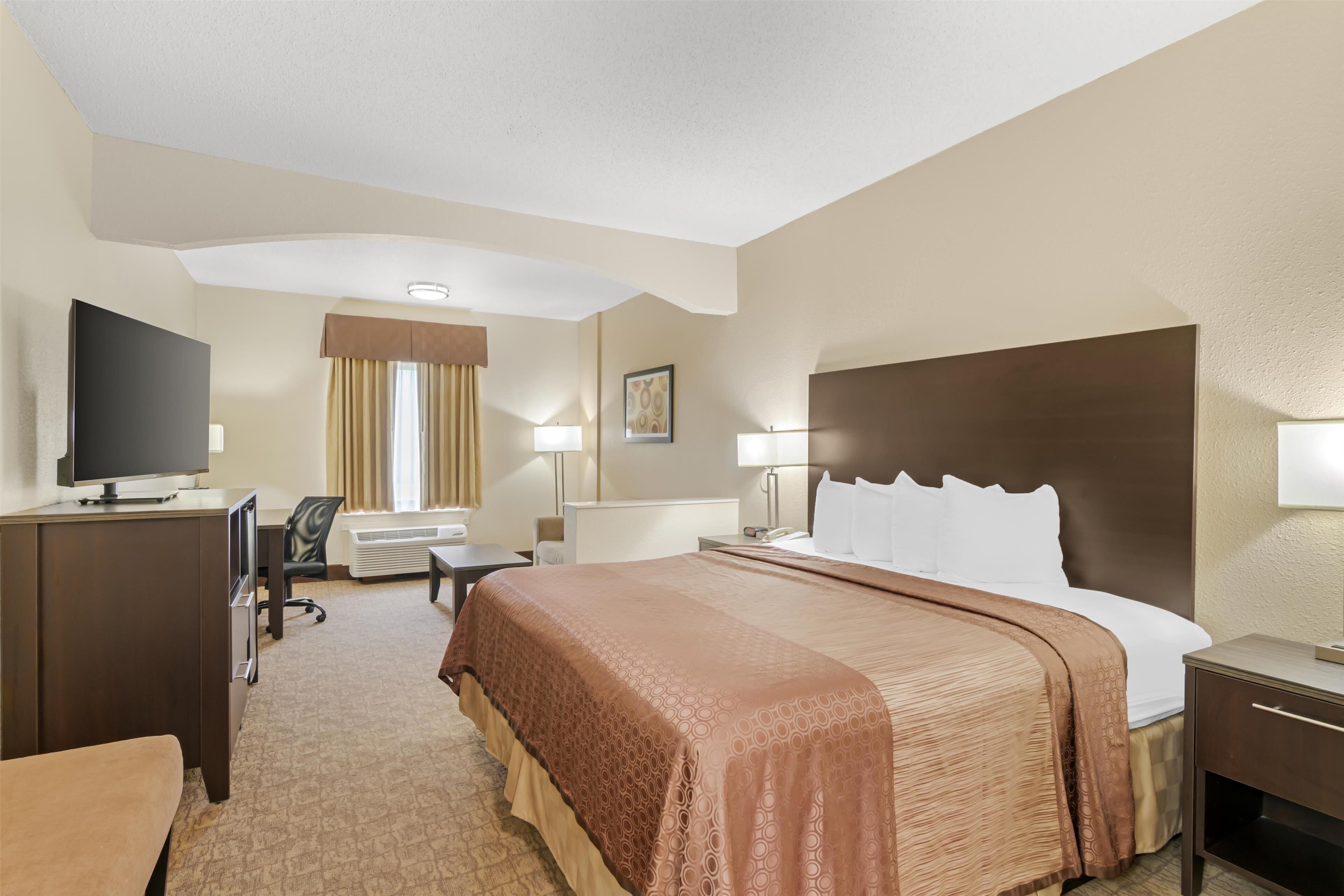 Desk, laptop workspace, blackout drapes, iron/ironing board