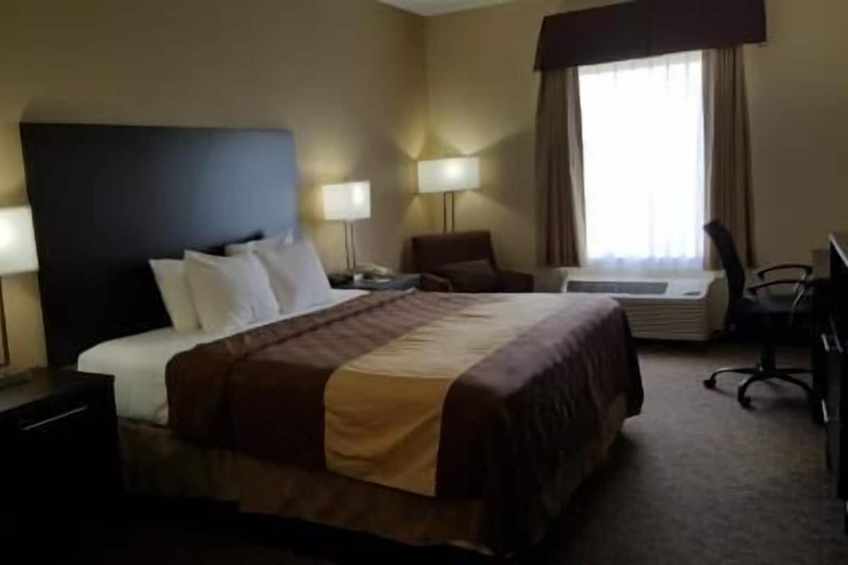 Desk, laptop workspace, blackout curtains, iron/ironing board