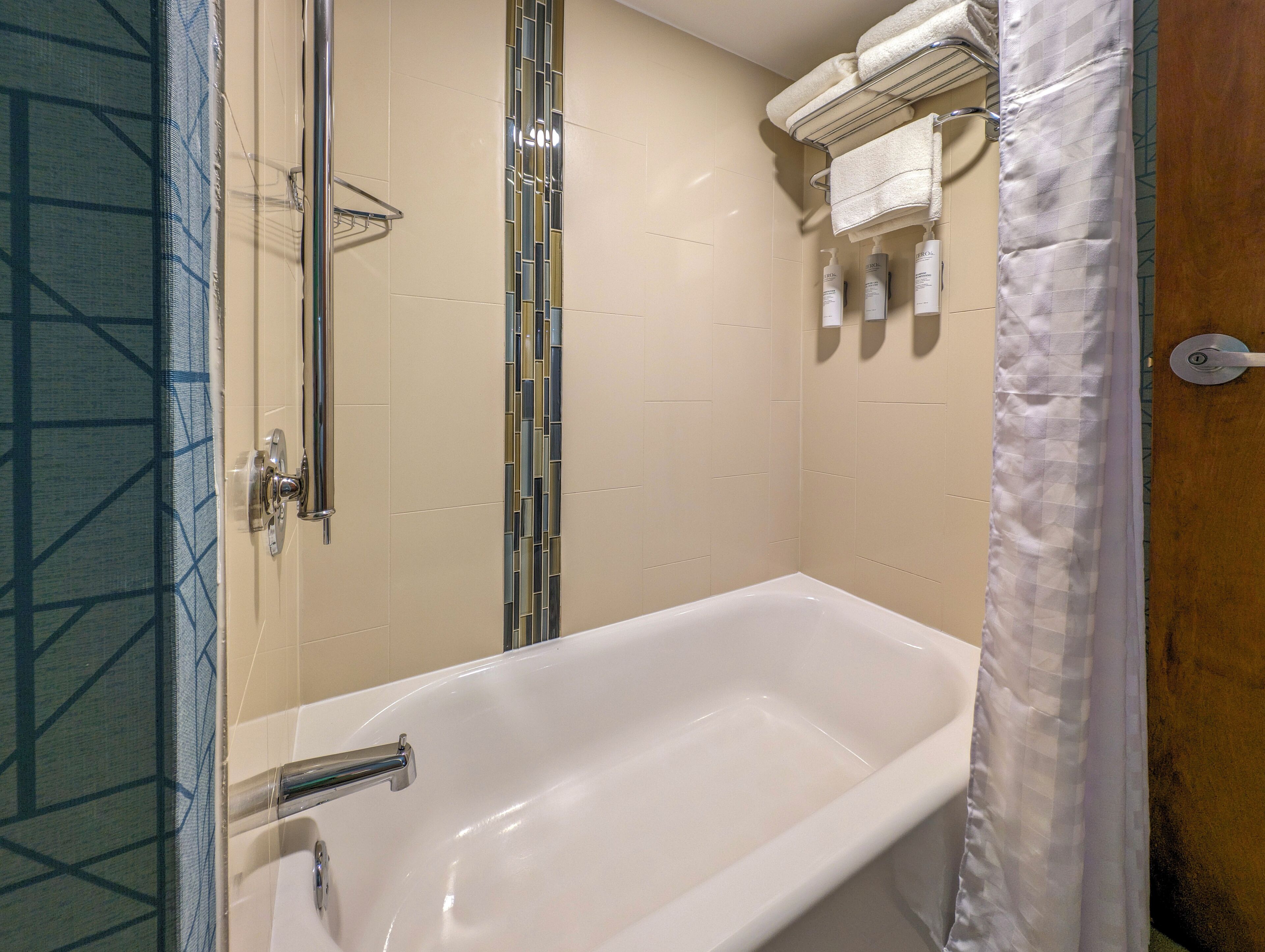 designer toiletries, hair dryer, towels, soap