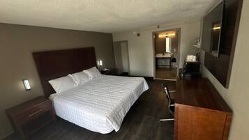 Desk, laptop workspace, blackout drapes, cribs/infant beds