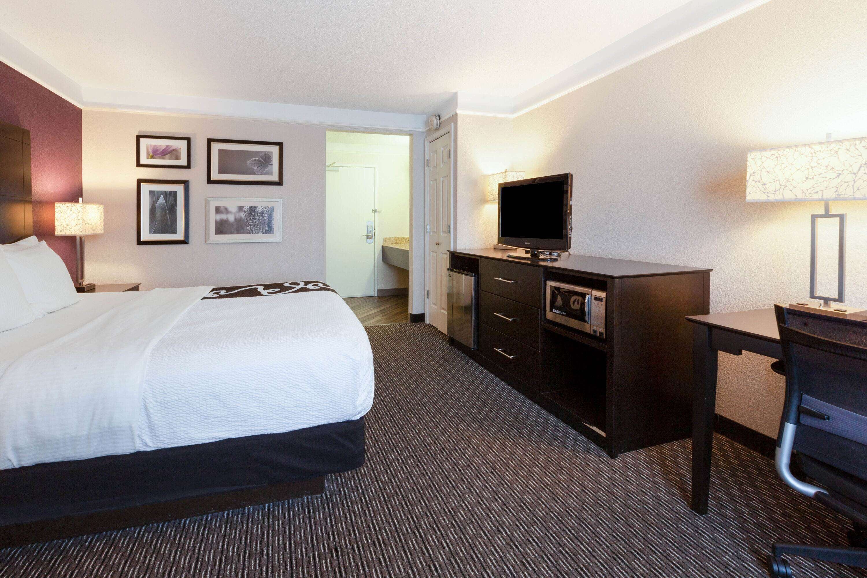 premium bedding, desk, blackout curtains, iron/ironing board