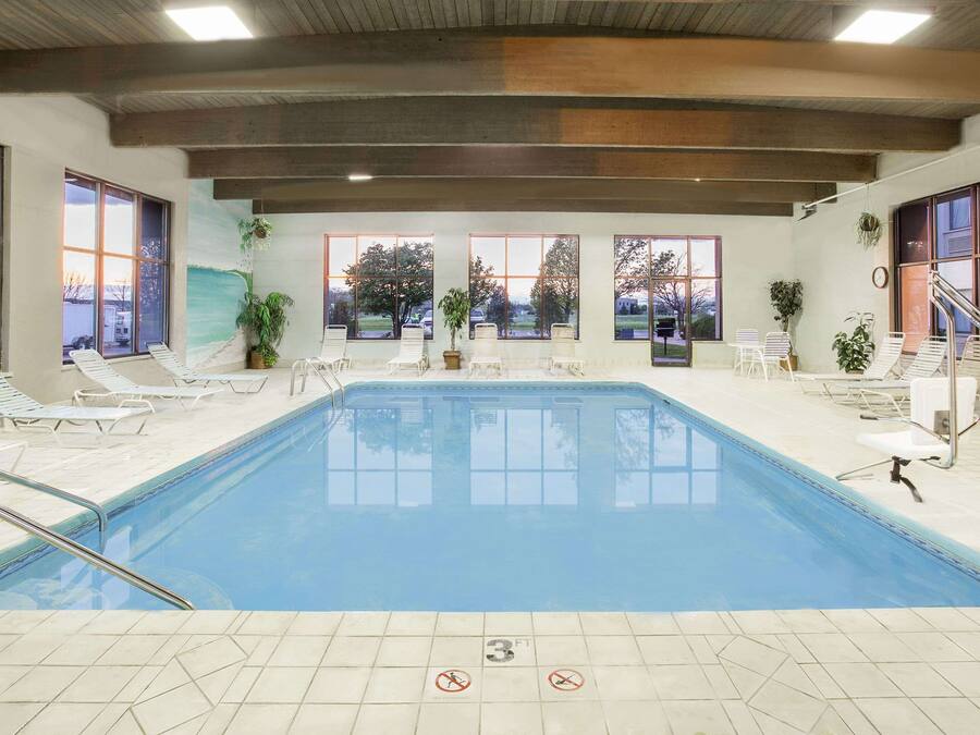 Indoor pool, open 6:00 AM to 10:00 PM, pool loungers
