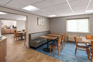 Enjoy a comfortable stay in this stylish room with a dining area, sofa, and kitchenette.