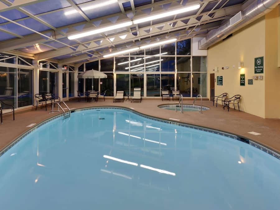 Indoor pool, open 7:00 AM to 11:00 PM, pool umbrellas, sun loungers