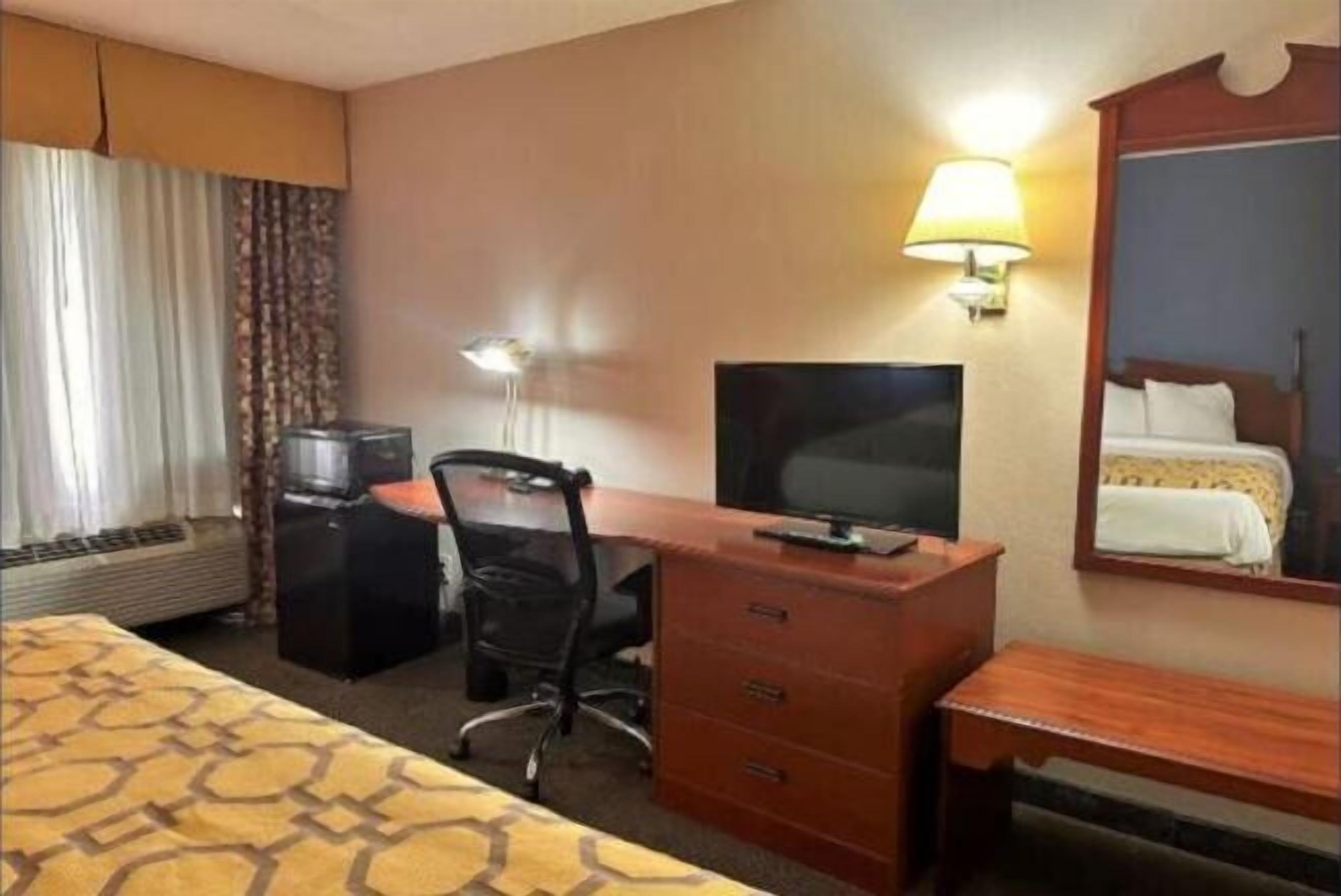 Desk, laptop workspace, blackout curtains, iron/ironing board