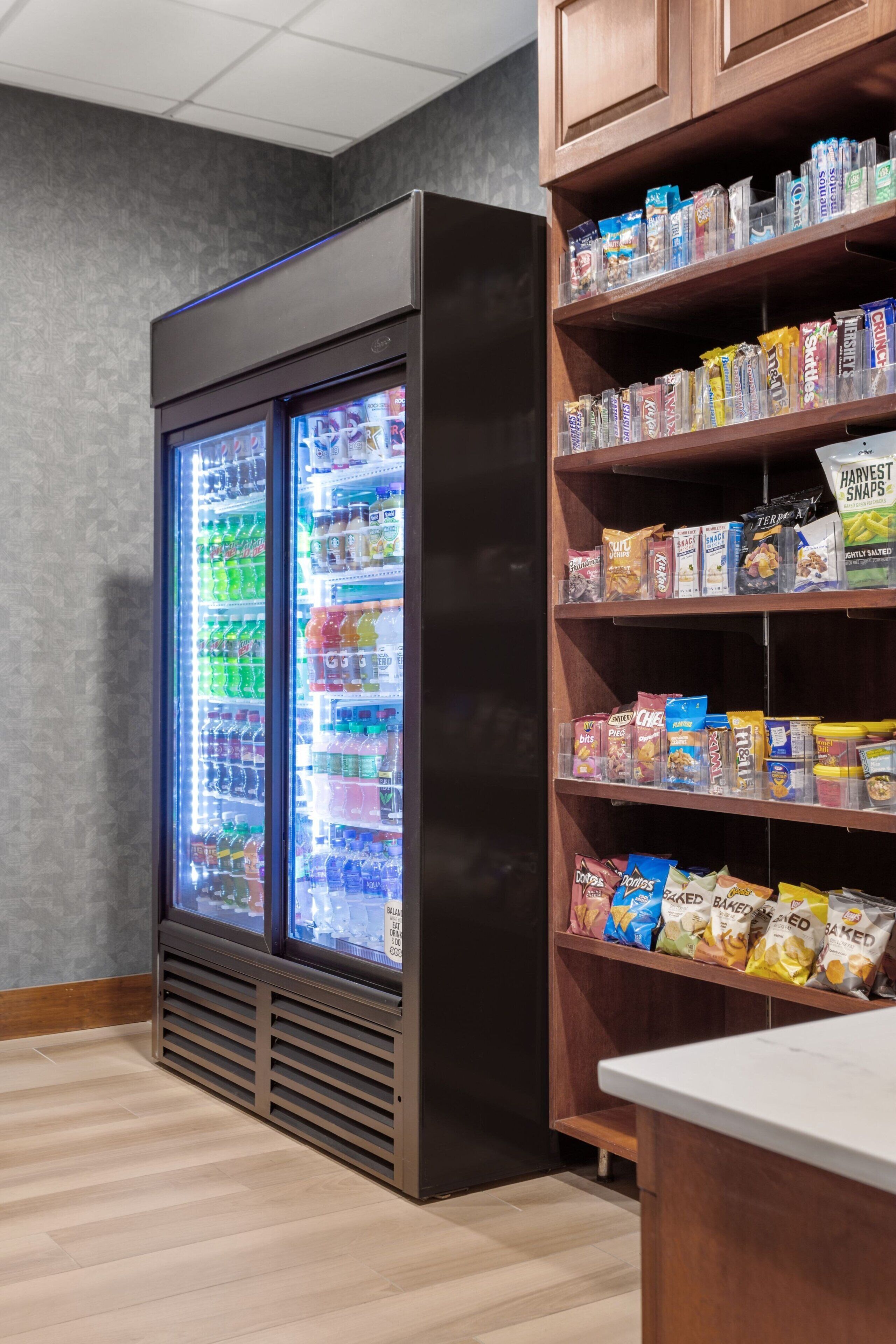 A vending machine with snacks and a refrigerated drink dispenser.
