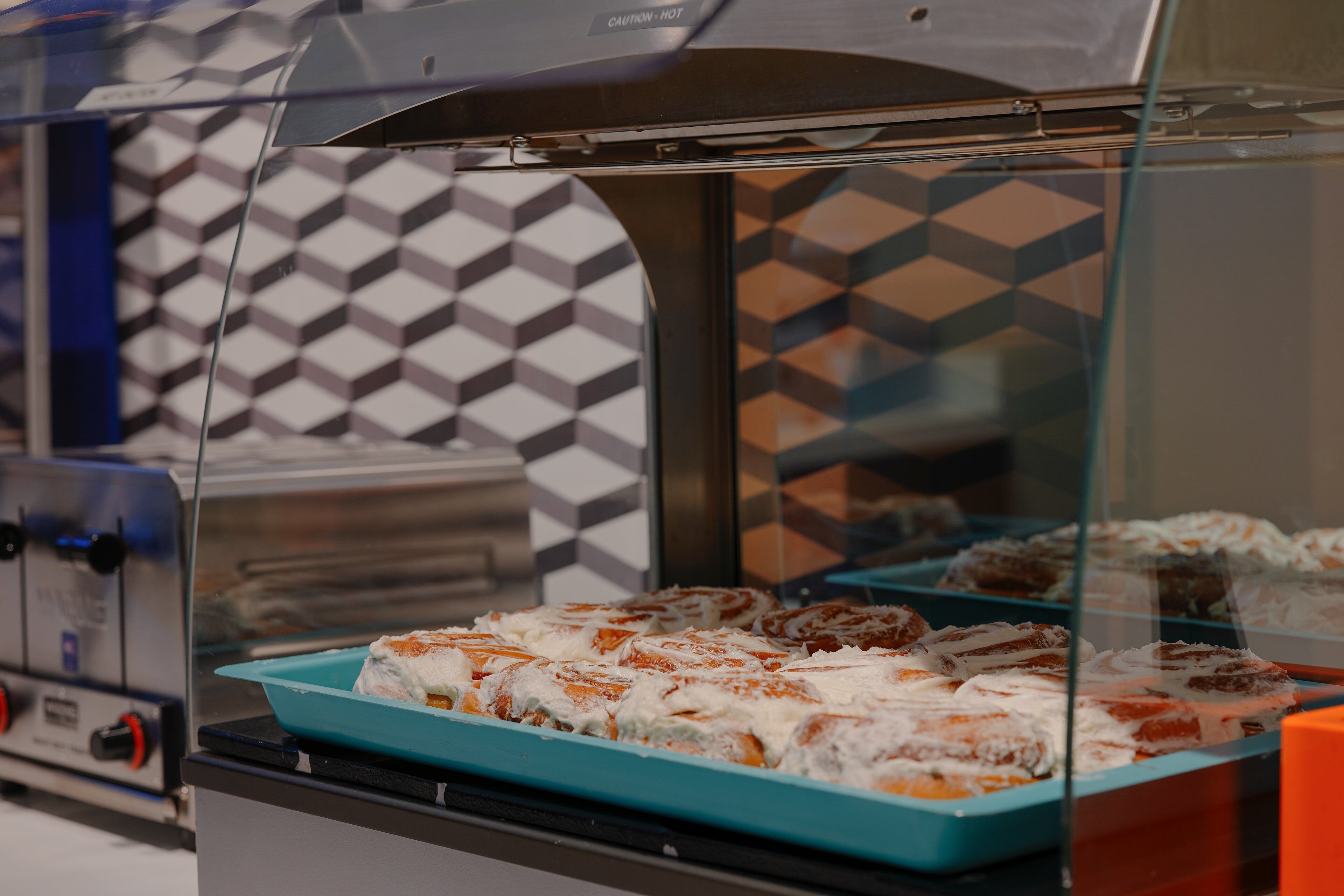 A food display case with pastries.