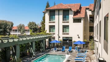 Outdoor pool, open 10:00 AM to 10:00 PM, pool umbrellas, pool loungers