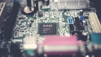A close-up of a motherboard with an Intel CPU socket.