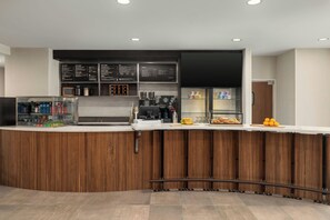 A modern bar area with a wooden counter, menu boards, and a coffee machine. - Courtyard by Marriott Beckley (Beckley)