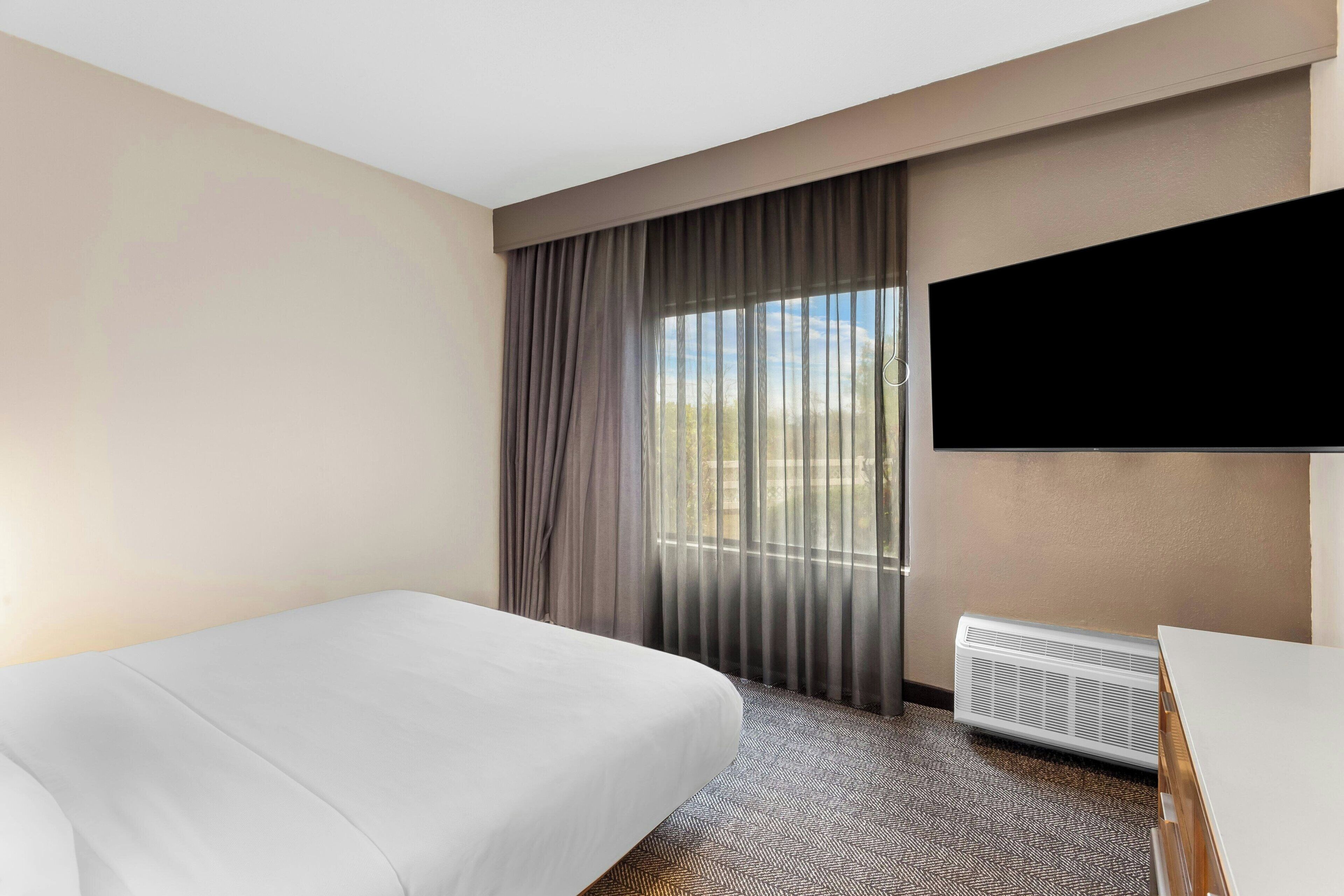 hypo-allergenic bedding, desk, blackout curtains, iron/ironing board