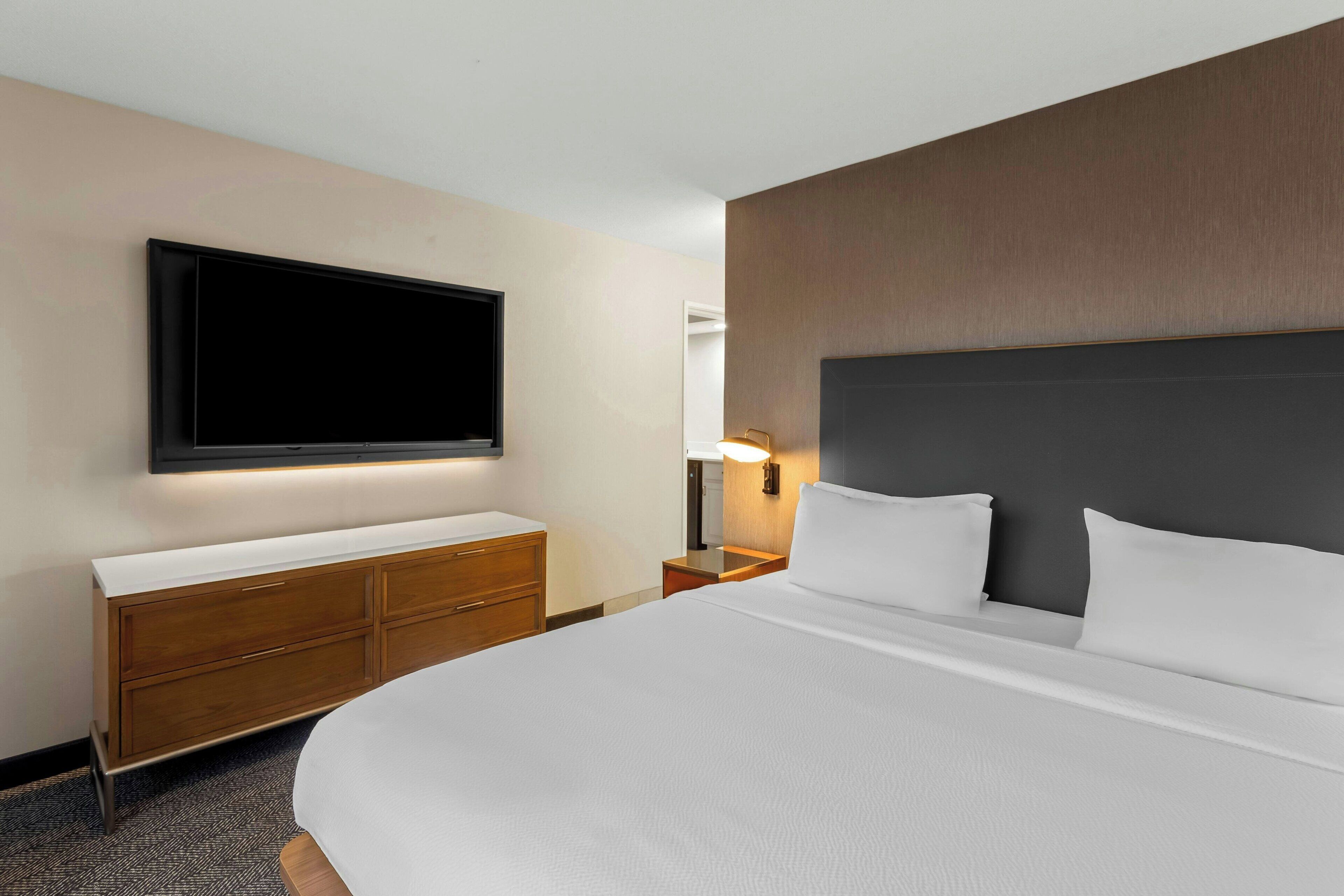 hypo-allergenic bedding, desk, blackout curtains, iron/ironing board