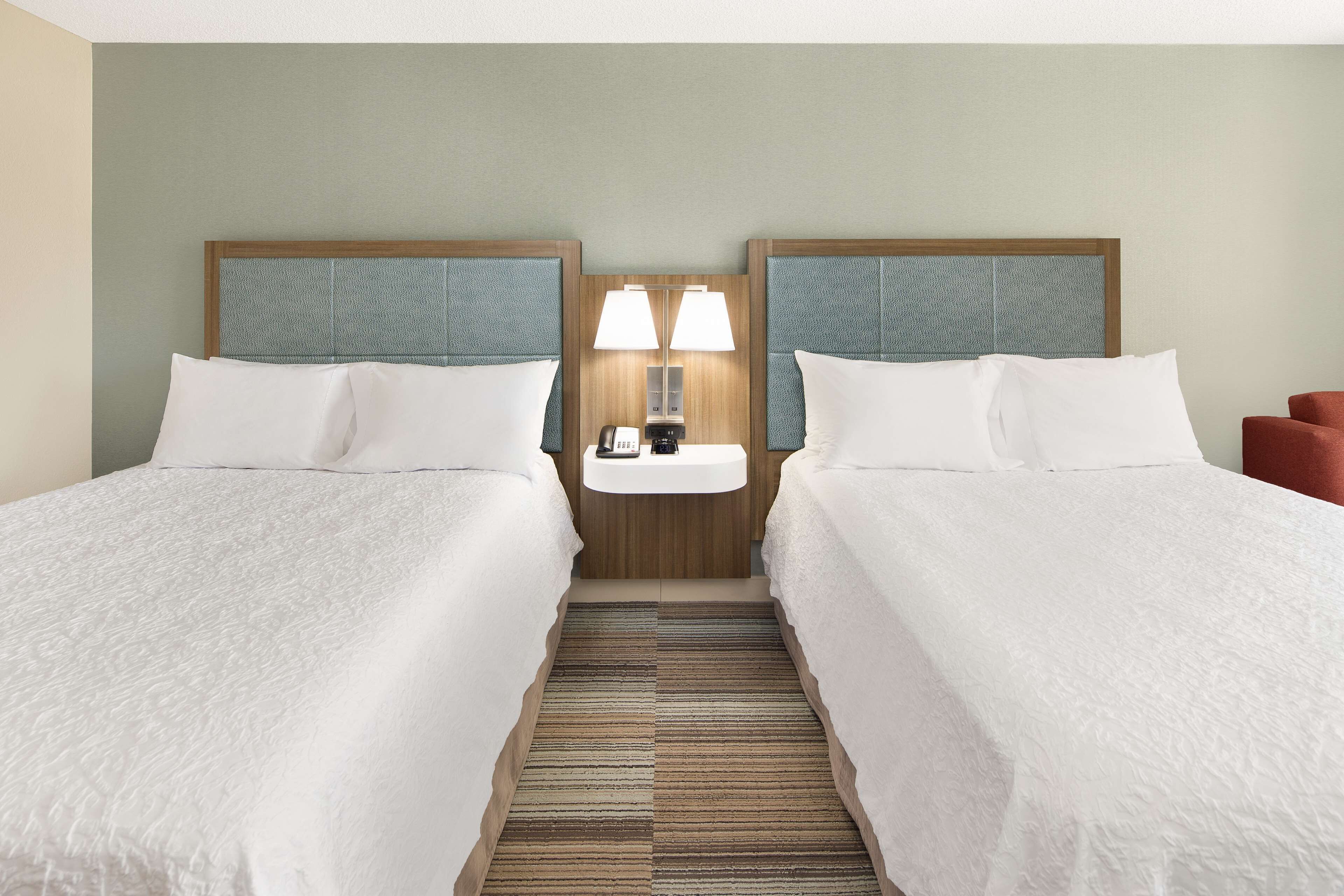 standard room with two queen beds | in-room safe, desk, laptop workspace, blackout curtains