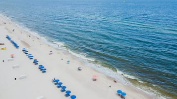 On the beach, white sand, beach towels, surfing