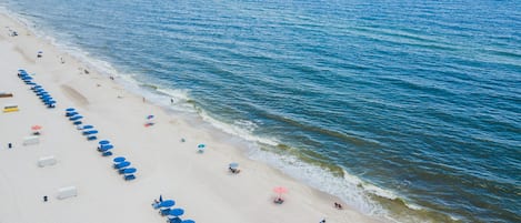 On the beach, white sand, beach towels, surfing