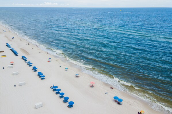 On the beach, white sand, beach towels, surfing