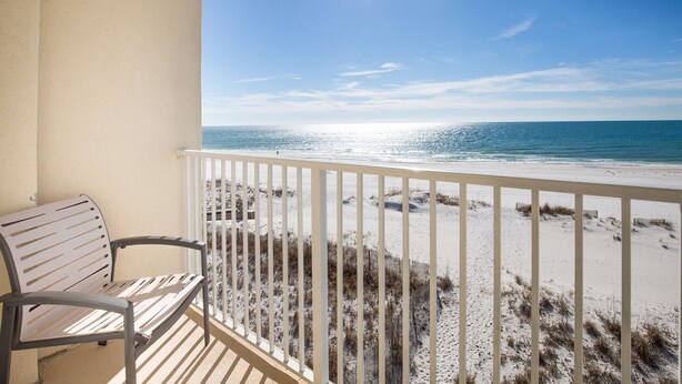 A balcony with a view of the beach and ocean. - Hilton Garden Inn Orange Beach Beachfront (Orange Beach)