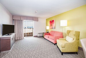 Suite, 1 King Bed | Living area | 32-inch LCD TV with premium channels, TV