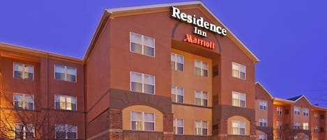 A multi-story hotel with a prominent "Residence Inn Marriott" sign.