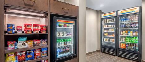 A vending area with snack and drink options, including chips, snacks, and bottled beverages.