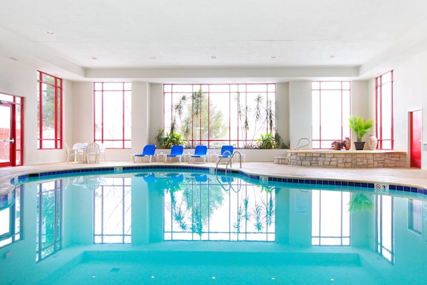 Indoor pool, open 7:00 AM to 11:00 PM, pool loungers