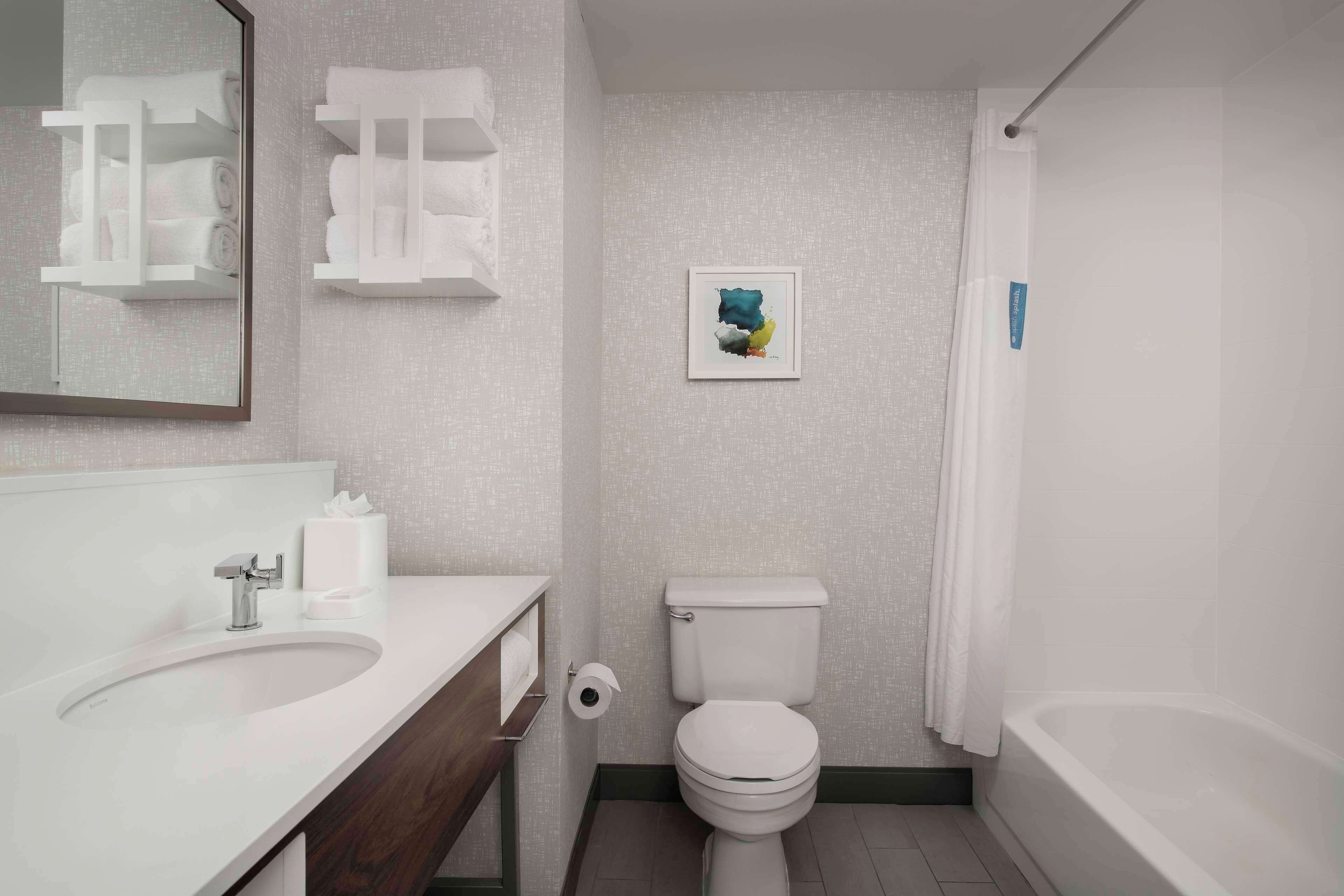 combined shower/bathtub, deep-soaking bathtub, designer toiletries