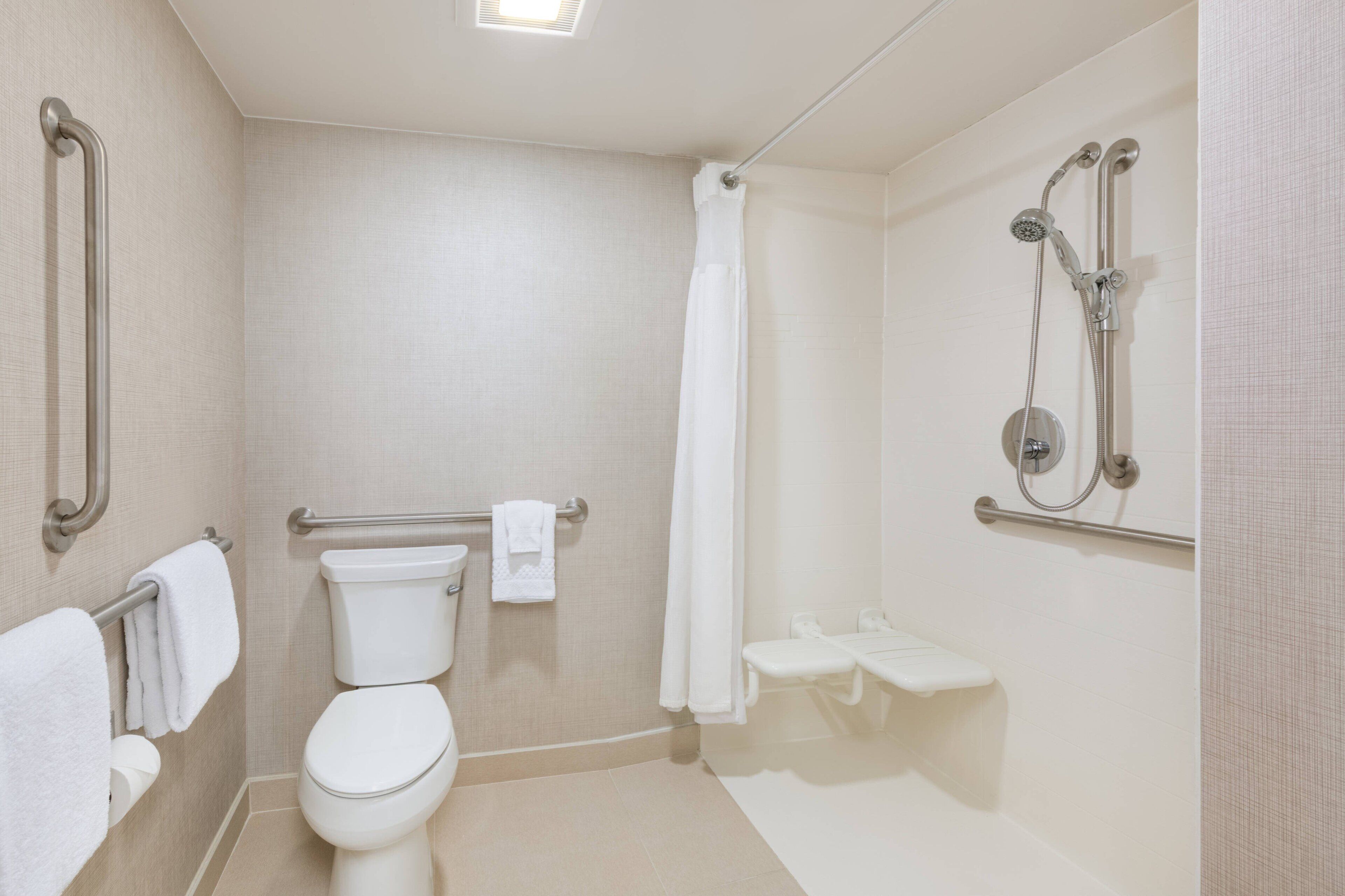 suite, 2 bedrooms, fireplace (mobility/hearing access, roll-in shwr) | bathroom | combined shower/bathtub, free toiletries, hair dryer, towels