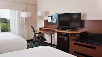 Hypo-allergenic bedding, down duvets, pillow-top beds, in-room safe