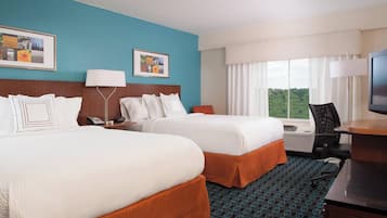 Hypo-allergenic bedding, down duvets, pillow-top beds, in-room safe